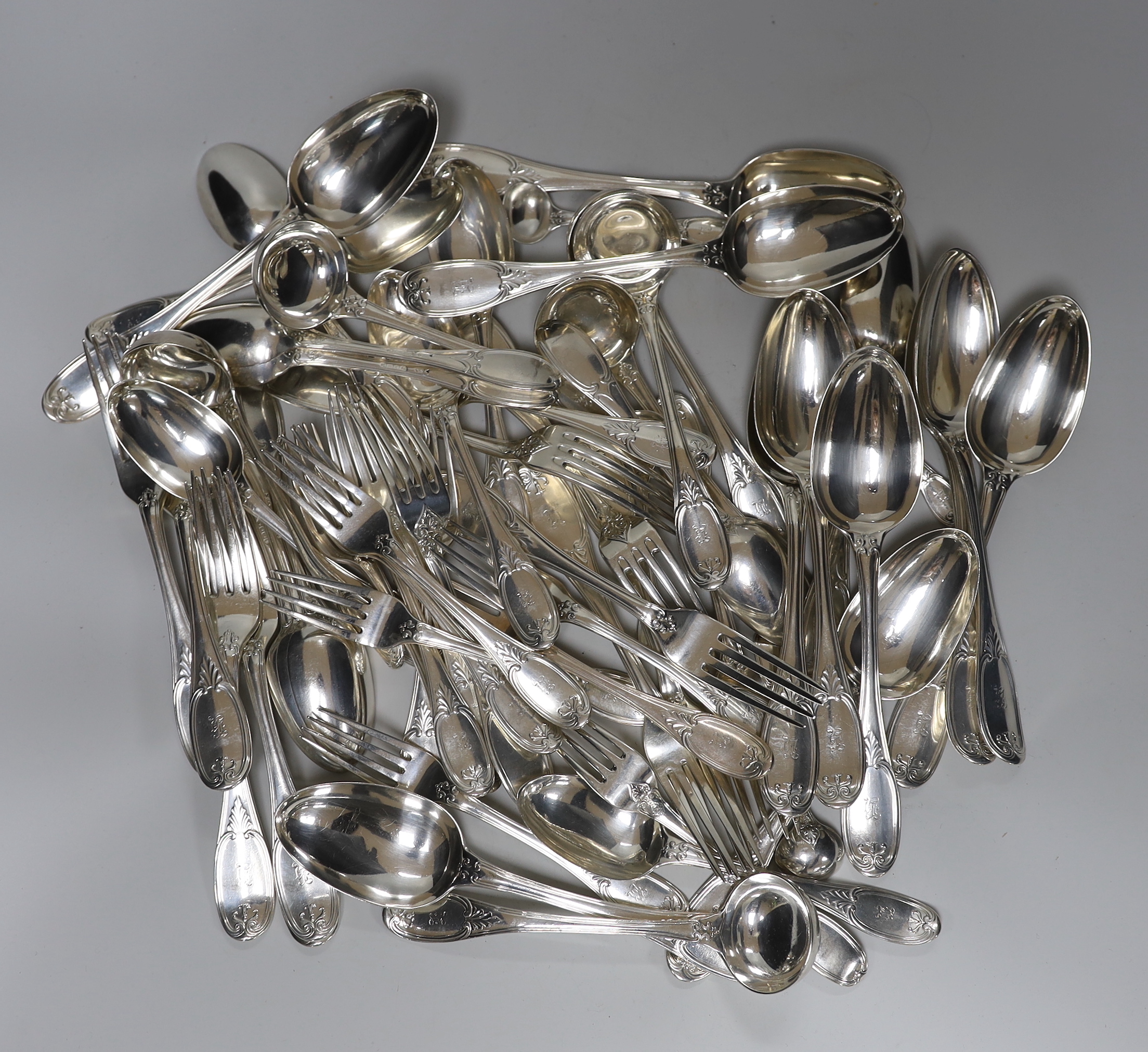 A Victorian part canteen of silver flatware by George Adams, comprising twelve table spoons, twelve table forks, twelve dessert forks, twelve dessert spoons, six sauce ladles and four condiment ladles, London, 1858